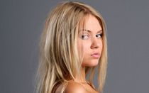 Swarthy chick in a green